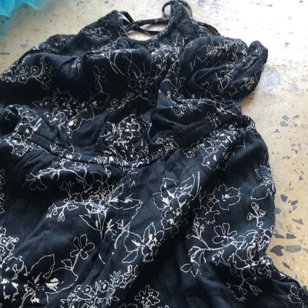 Black jumpsuit with white flowers